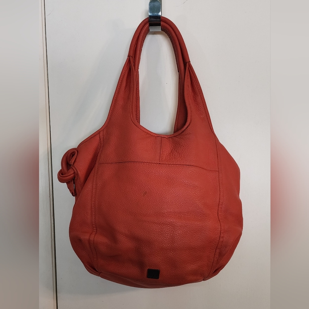 Kooba leather tote bag, orange, a couple of spots on bag. Bag included